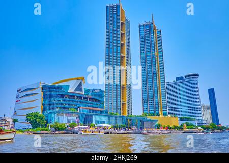 BANGKOK, THAILAND - MAY 12, 2019: The facade of the modern Iconsiam shopping mall and Magnolias Waterfront Residences skyscrapers from the Chao Phraya Stock Photo