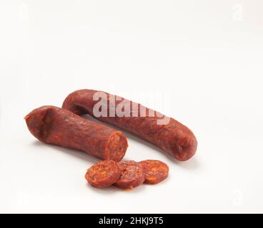 Chopped, halved and whole Mangalica, long Hungarian sausage Stock Photo