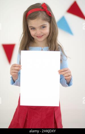 Girl holding piece of blank white paper Stock Photo