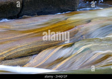 smoothly polished rocks in the Verzasca mountain river, shapes and colours on overflowing rocks, Switzerland, Ticino, Lavertezzo Stock Photo