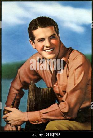 Hand colored publicity photo of actor Robert Cummings also known as Bob Cummings circa 1930s with Universal Pictures. Stock Photo