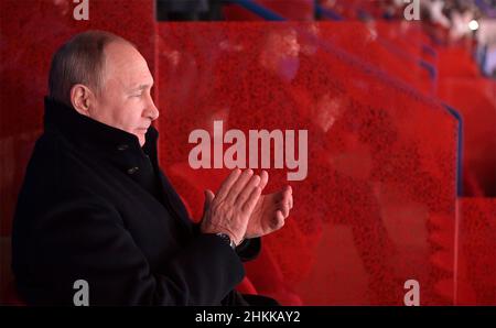 Beijing, China. 04th Feb, 2022. Russian President Vladimir Putin applauds during the opening ceremony of the 2022 Beijing Winter Olympics in the VIP section of National Stadium, February 4, 2022 in Beijing, China. Putin attended the Olympics as a guest of Chinese President Xi Jinping. Credit: Alexei Druzhinin/Kremlin Pool/Alamy Live News Stock Photo