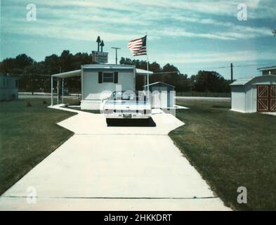 Abstract view of a car and mobile home in a trailer park in Indiana, ca. 1970. Stock Photo