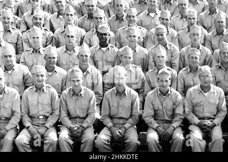 A single African American soldier poses with the rest of his U.S. Army unit for a photo in the 1950s. Stock Photo