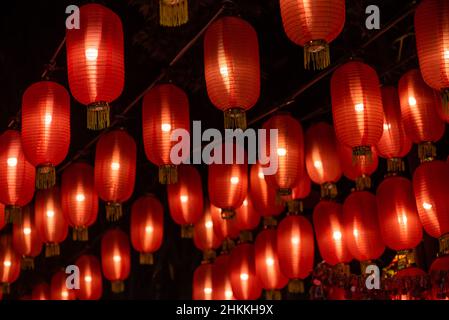 Red Chinese lanterns hanging on a ceiling Stock Photo