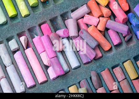 Chalk sticks various colors in a box close up, colorful chalk pastel for preschool children, kid stationary for art painting education. Stock Photo