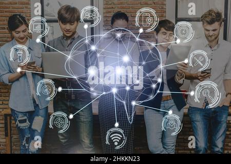 Polygonal brain shape of an artificial intelligence with various icon of smart city Internet of Things Technology over Group Of Multiethnic people usi Stock Photo