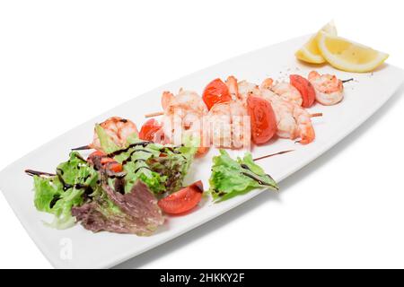 Grilled shrimp skewers. Isolated on a white background. Stock Photo