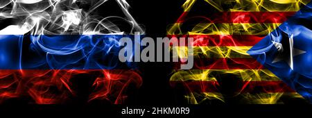 Russia, Russian vs Catalonia, Catalan, Catalonian, Spain flags. Smoke flag placed side by side isolated on black background. Stock Photo