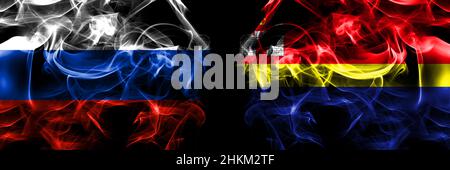 Russia, Russian vs Russia, Russian, Kaliningrad Oblast flags. Smoke flag placed side by side isolated on black background. Stock Photo