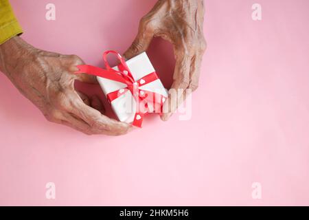 high angle view of gift box on hand. Stock Photo