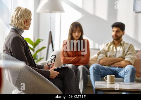 Married couple having psychological consultation in office Stock Photo