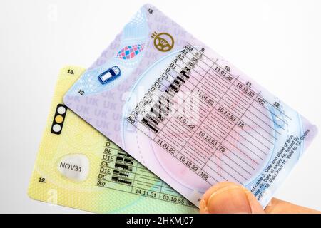 UK Driving Licence. Provisional and Full licence cards and car key on top of them. Stafford, United Kingdom, January 30, 2022. Stock Photo