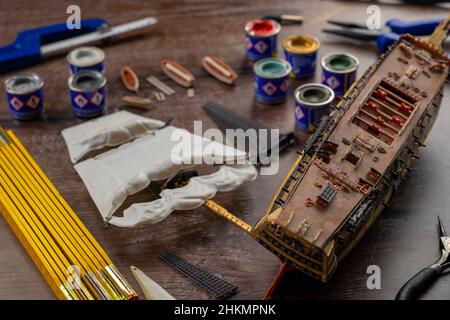 Top View Model Ship Building handcraft on table with different materials Stock Photo