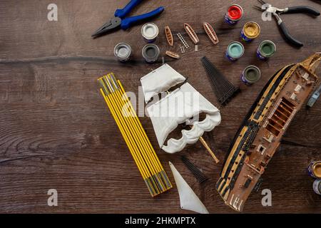 Model Ship Building handcraft on table with different materials with writing space Stock Photo