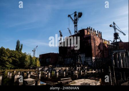 The 5th reactor at the Chernobyl Nuclear Power Plant was never finished and now lies a rusty, industrial wasteland. Stock Photo