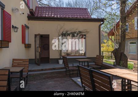 Zelenogradsk, Russia - may 11, 2021: exterior of korean shop and outdoor cafe area view Stock Photo