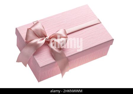 Closed gift box with pink ribbon bow on a white background. A single isolated object. Holiday wrapping Stock Photo