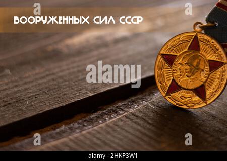 Wallpaper with The Jubilee Medal 50 Years of the Armed Forces of the USSR  in Russian Stock Photo