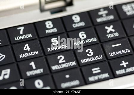 Different famous cities, various capitals of the world, city names on number buttons, object detail, closeup, nobody. Travel industry, traveling, choi Stock Photo