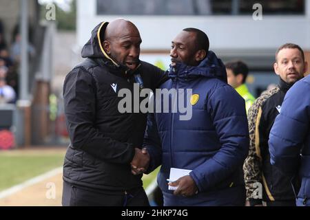 Burton Upon Trent, UK. 05th Feb, 2022. Darren Moore manager of Sheffield Wednesday meets with Jimmy Floyd Hasselbaink manager of Burton Albion right before kick off in Burton upon Trent, United Kingdom on 2/5/2022. (Photo by James Heaton/News Images/Sipa USA) Credit: Sipa USA/Alamy Live News Stock Photo