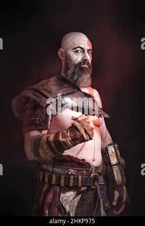 BLOODY WARRIOR. WITH A BEARD AND SCARS. COSPLAY Stock Photo