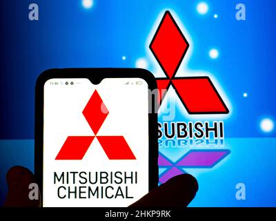 In this photo illustration, the Mitsubishi Chemical logo is displayed on a smartphone screen with a Mitsubishi Corporation logo in the background. Stock Photo