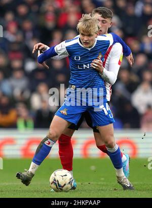 Doncaster Rovers' Matthew Smith (left) and Sunderland's Dan Neil battle for the ball during the Sky Bet League One match at the Stadium of Light, Sunderland. Picture date: Saturday February 5, 2022. Stock Photo