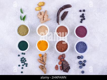 Various healthy superfoods powder assortment Stock Photo - Alamy