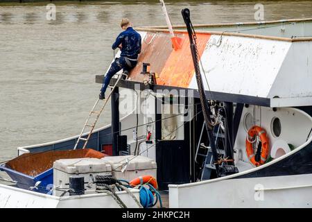 Maintenance work being carried out on river boat, River Thames, London, UK. Stock Photo