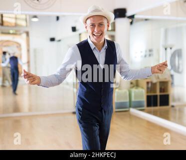 Portrait of man practicing swing in dance studio Stock Photo