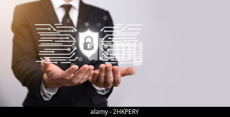 Protection network security computer and safe your data concept, Businessman holding shield protect icon. lock symbol, concept about security, cyberse Stock Photo