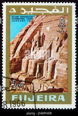 FUJEIRA - CIRCA 1966: a stamp printed in Fujeira shows Statues at Abu Simbel, Egypt, circa 1966 Stock Photo