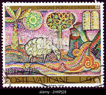 VATICAN - CIRCA 1974: a stamp printed in Vatican shows lamb drinking from stream and tablets of the law, mosaic, circa 1974 Stock Photo