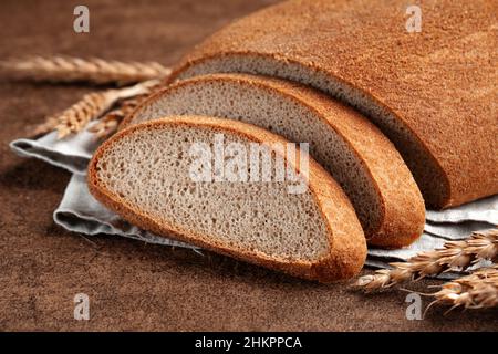 Fresh baked sliced loaf of peasant bread Stock Photo