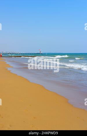 Waves at beautiful sandy beach in a sunny summer day in Antalya Turkey Stock Photo