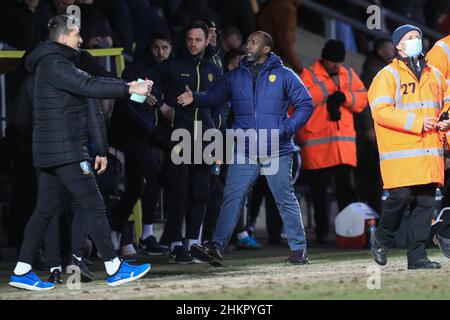 Burton Upon Trent, UK. 05th Feb, 2022. Jimmy Floyd Hasselbaink manager of Burton Albion shakes hands with Darren Moore manager of Sheffield Wednesday after the game in Burton upon Trent, United Kingdom on 2/5/2022. (Photo by James Heaton/News Images/Sipa USA) Credit: Sipa USA/Alamy Live News Stock Photo