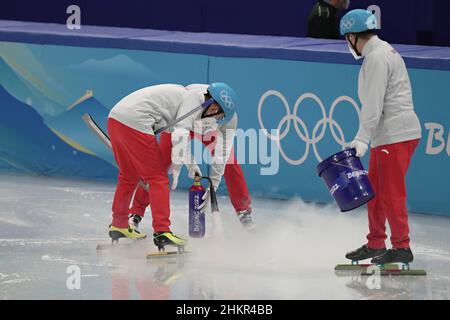 Beijing, China. 05th Feb, 2022. Workers use liquid nitrogen to repair a damaged section of the ice during the Men's 1000m Short Track Speed Skating heats at the Beijing Winter Olympic in Beijing on Saturday, February 5, 2022. Photo by Richard Ellis/UPI Credit: UPI/Alamy Live News Stock Photo