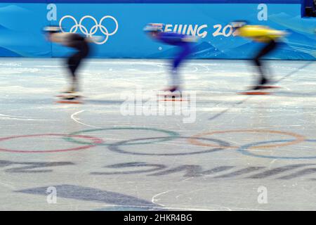 Beijing, China. 05th Feb, 2022. Competitors speed past the Olympic Rings during the Men's 1000m Short Track Speed Skating heats at the Beijing Winter Olympic in Beijing on Saturday, February 5, 2022. Photo by Richard Ellis/UPI Credit: UPI/Alamy Live News Stock Photo