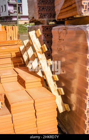 Wooden pallet on a pile of blocks for the construction of a residential building. Stock Photo