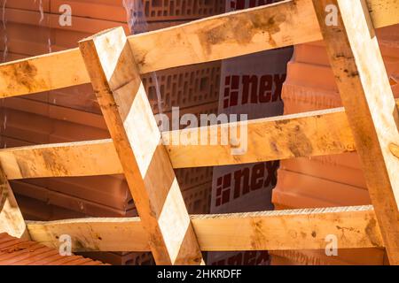 Wooden pallet on a pile of blocks for the construction of a residential building. Stock Photo