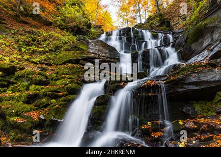 Beautiful Waterfall Shipot in the autumn forest of the Carpathian Mountains Stock Photo