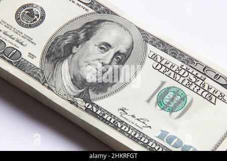 Pack of dollars. A stack of one hundred dollar bills. Lots of new dollars banknotes. Bundle of dollars. Beautiful stack of money background. Business Stock Photo
