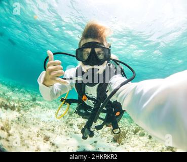 young dive instructor taking a selfie in the caribbean Stock Photo