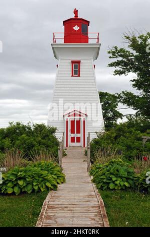 The historic Leards Range Front Lighthouse, housing the Victoria Seaport Museum, stands as a landmark in the south shore village of Victoria, PEI. Stock Photo