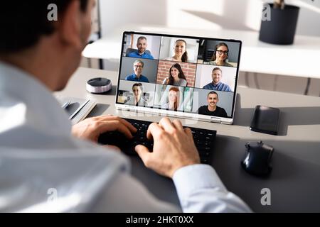 Online Video Conference Meeting On Tablet In Office Stock Photo