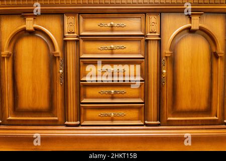 Wooden chest of drawers in the bedroom. Stock Photo