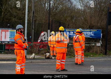 Uxbridge, London Borough of Hillingdon, UK. 5th February, 2022. HS2 Security filming and watching protesters. A large group of Stop HS2 protesters walked from the London Borough of Hillingdon Civic Centre in Uxbridge today to the HS2 High Speed Rail site in Harvil Road, Uxbridge on the outskirts of Harefield. Sarah Green of the Hillingdon Green Party is calling on Hillingdon Council to do more to protect the local drinking water supplies from the risk of contamination by HS2 work on the High Speed 2 rail project. On Monday 7th February HS2 close Harvil Road and start works on the South Embankm Stock Photo