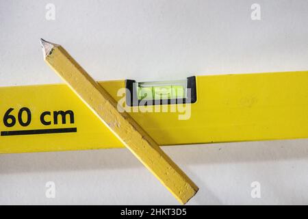 spirit level and yellow pencil Stock Photo