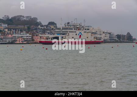 EAST COWES, ENGLAND – FEBRUARY 1  2021: Red Funnel Car Ferry coming in to port. East Cowes, Isle of Wight, UK, landscape Newport, Isle of Wight, UK, l Stock Photo